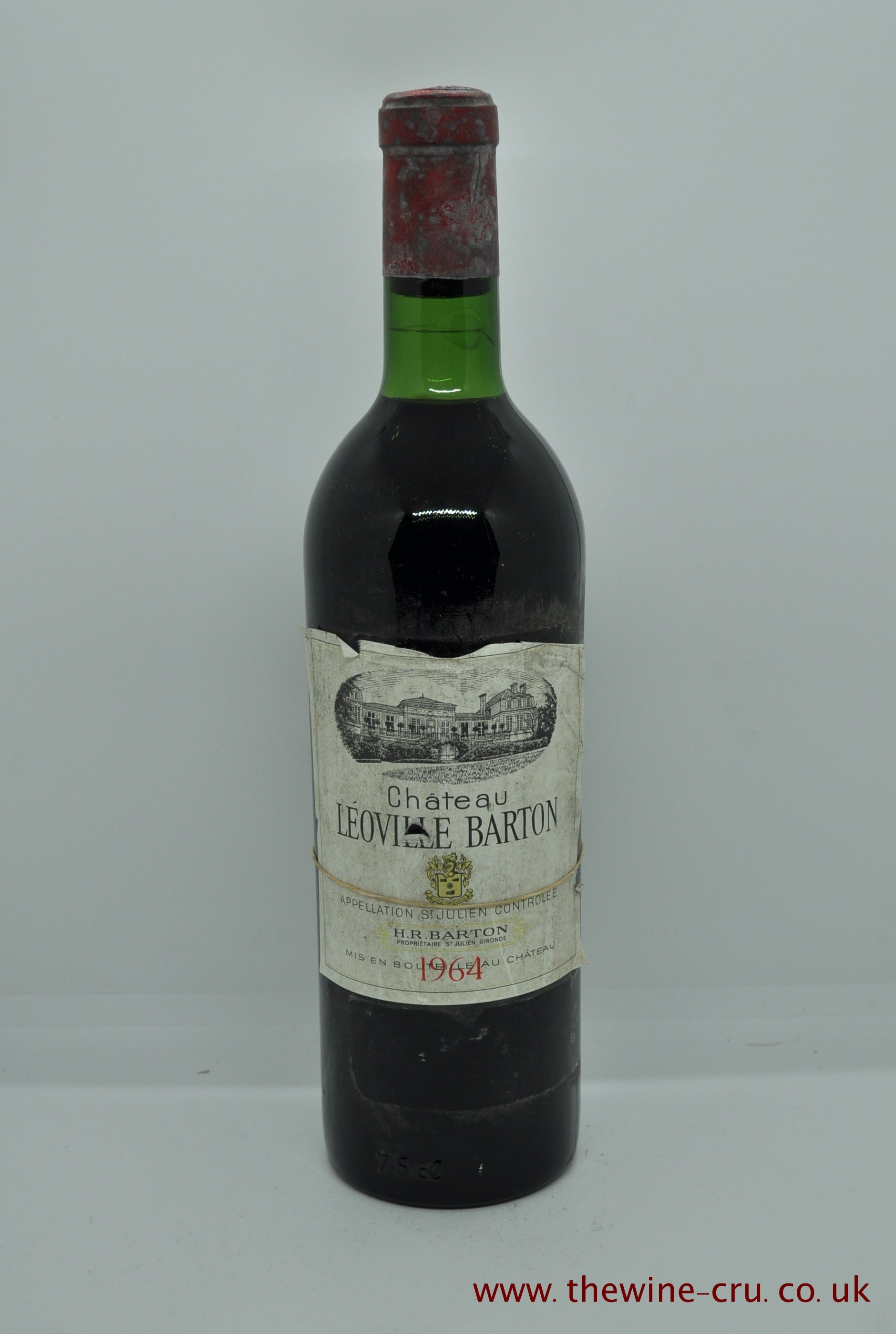A bottle of 1964 vintage red wine. Chateau Leoville Barton 1964 Bordeaux France. The bottle is in good condition, the label is complete but loose. The wine level is very top shoulder. immediate delivery. Free local delivery. Gift wrapping available.