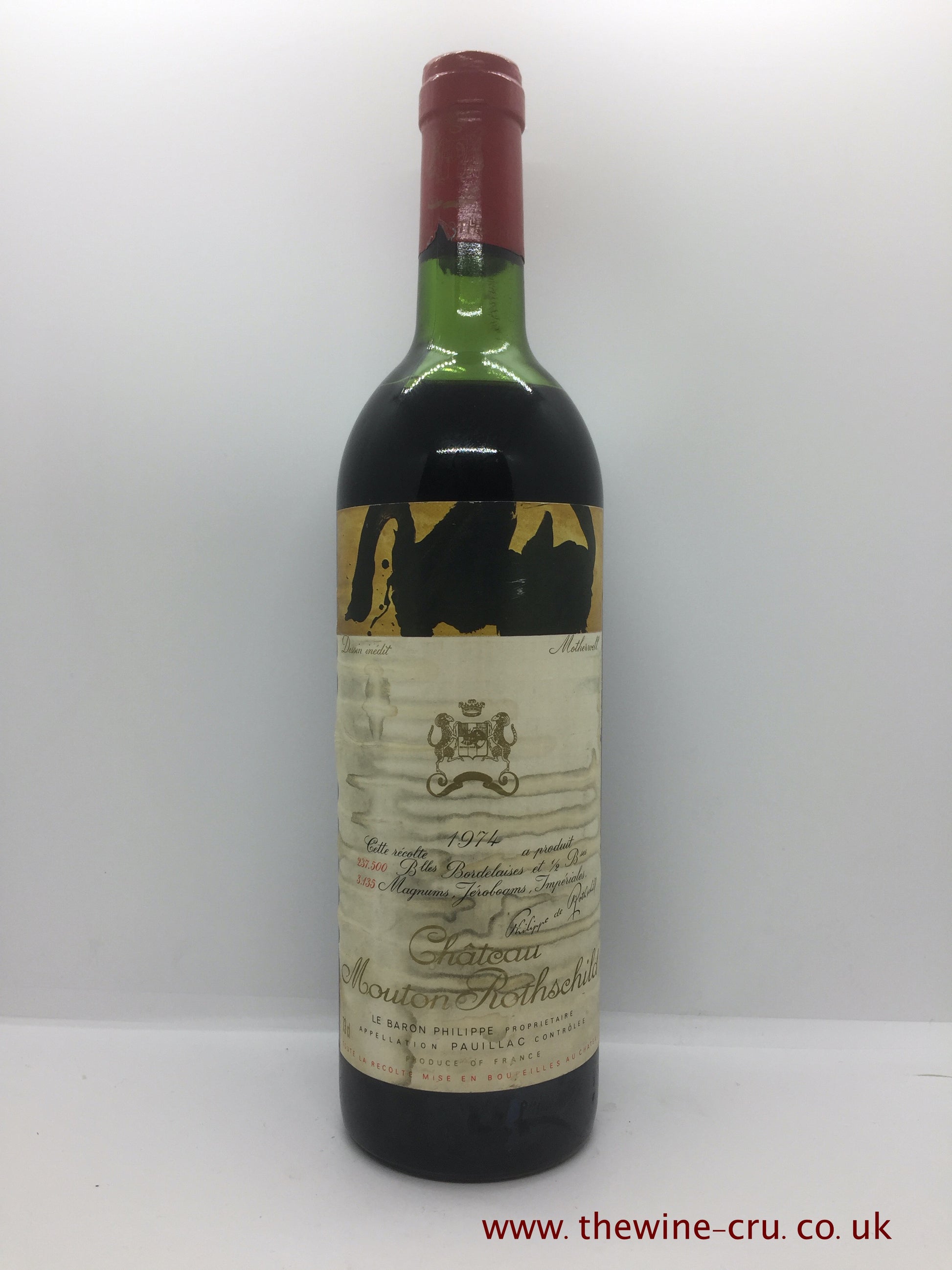 A bottle of 1974 vintage red wine. Chateau Mouton Rothschild. Bordeaux, France. The bottle is in good condition. The label is glue stripped and a little stained. The wine level is high shoulder. Immediate delivery. Free local delivery. Gift wrapping available.