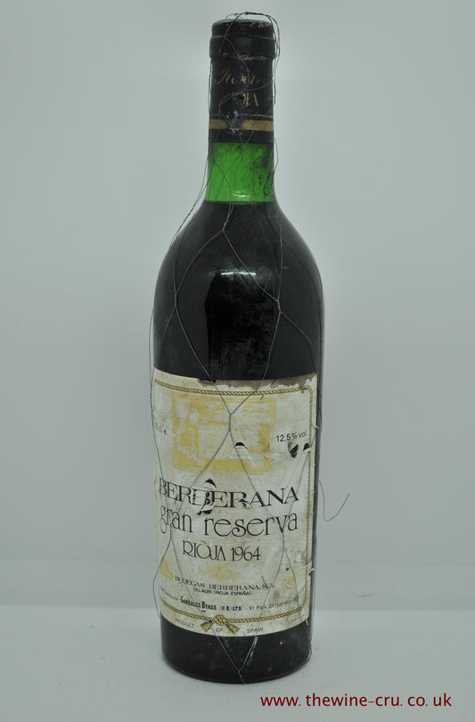 1964 vintage red wine. Berberana Grand Reserva Rioja. Spain. The capsule is ok, the label a little scrappy. The wire cage is broken in places . The wine level is base of neck. Immediate delivery. Free local delivery. Gift wrapping available.