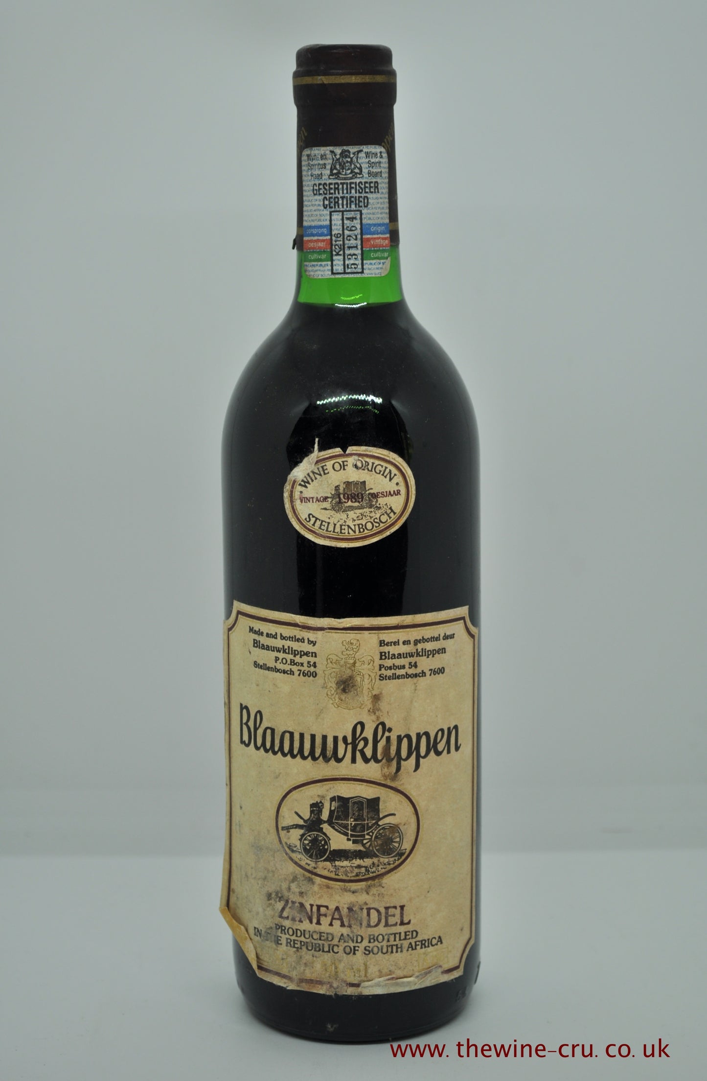 A bottle of 1989 vintage red wine. Blaauwklippen Zinfandel 1989. South Africa. Capsule good. Label complete but a bit scrappy around the edges. Wine level base of neck. Immediate delivery. Free local delivery. Gift wrapping available.