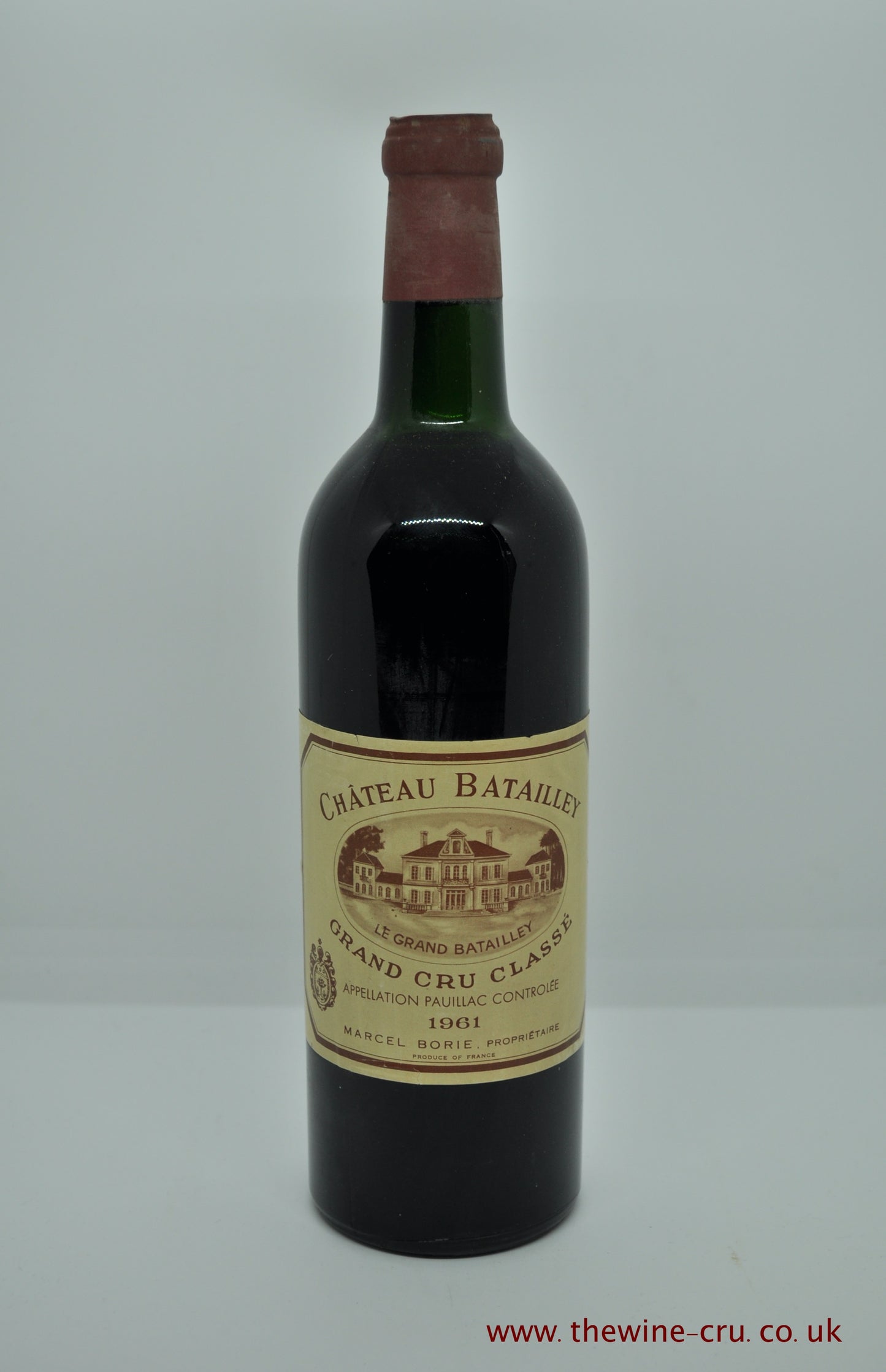 A bottle of 1961 vintage red wine from Chateau Batailley, Bordeaux, France. The bottle is in very good condition, with the wine level at top shoulder. Available for immediate delivery, free local delivery and gift wrapping.