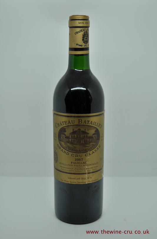 A bottle of 1987 vintage red wine from Chateau Batailley, Bordeaux, France. The bottle is in good condition with the fill level at the base of the neck. Immediate delivery. Free local delivery. Gift wrapping available.