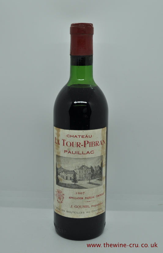 A bottle of 1967 vintage red wine from Chateau La Tour Pibran, Pauillac, Bordeaux, France. The bottle is in good condition with the wine level top shoulder. Immediate delivery. Free local delivery. Gift wrapping available.