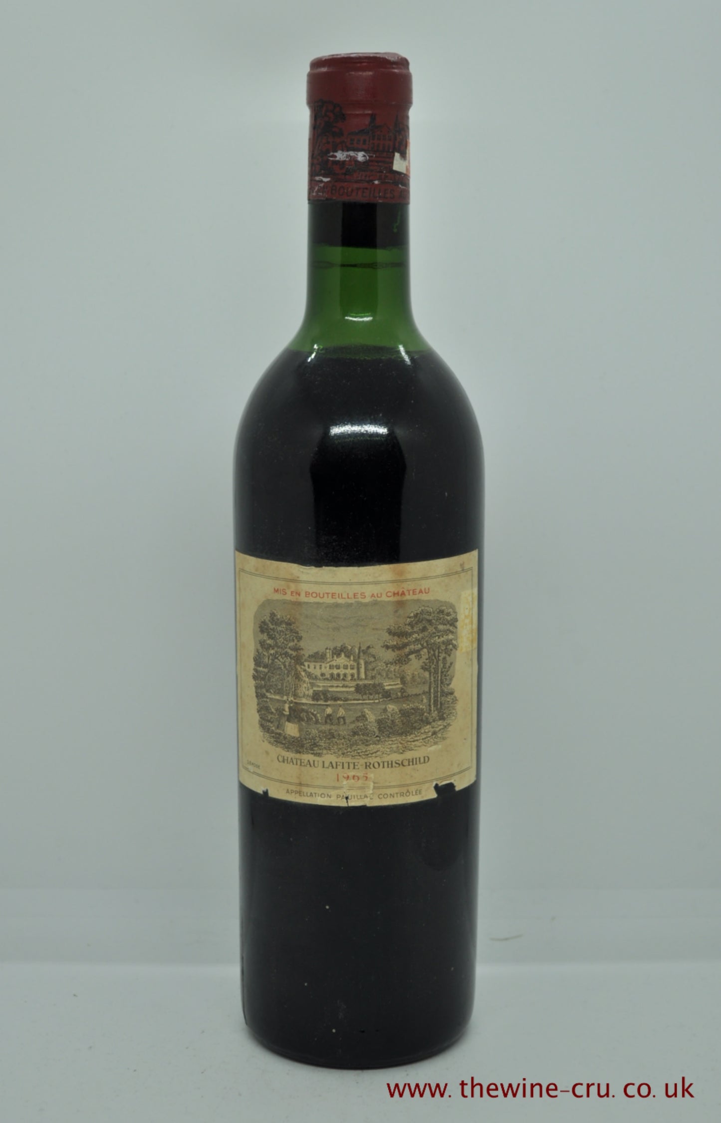1965 vintage red wine. Chateau Lafite Rothschild. France, Bordeaux. The capsule has a little corrosion and the label has some nicks. The wine level is top shoulder. Immediate delivery. Free local delivery. Gift wrapping available.