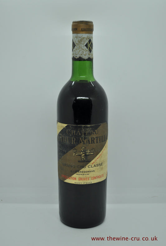 A bottle of 1967 vintage red wine from Chateau Latour Martillac, Graves, Bordeaux, France. The bottle is in good condition with the wine level at very top shoulder. Immediate delivery. Free local delivery. Gift wrapping available.