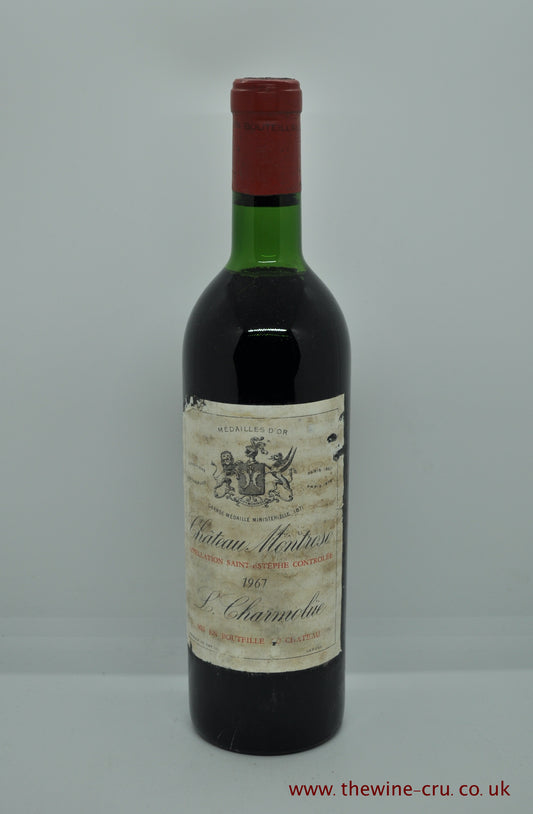 A bottle of 1967 vintage red wine from Chateau Montrose, Saint-Estephe, Bordeaux France. General condition is ok, but the labels are bin soiled. Immediate delivery. Free local deliver. Gift wrapping available.