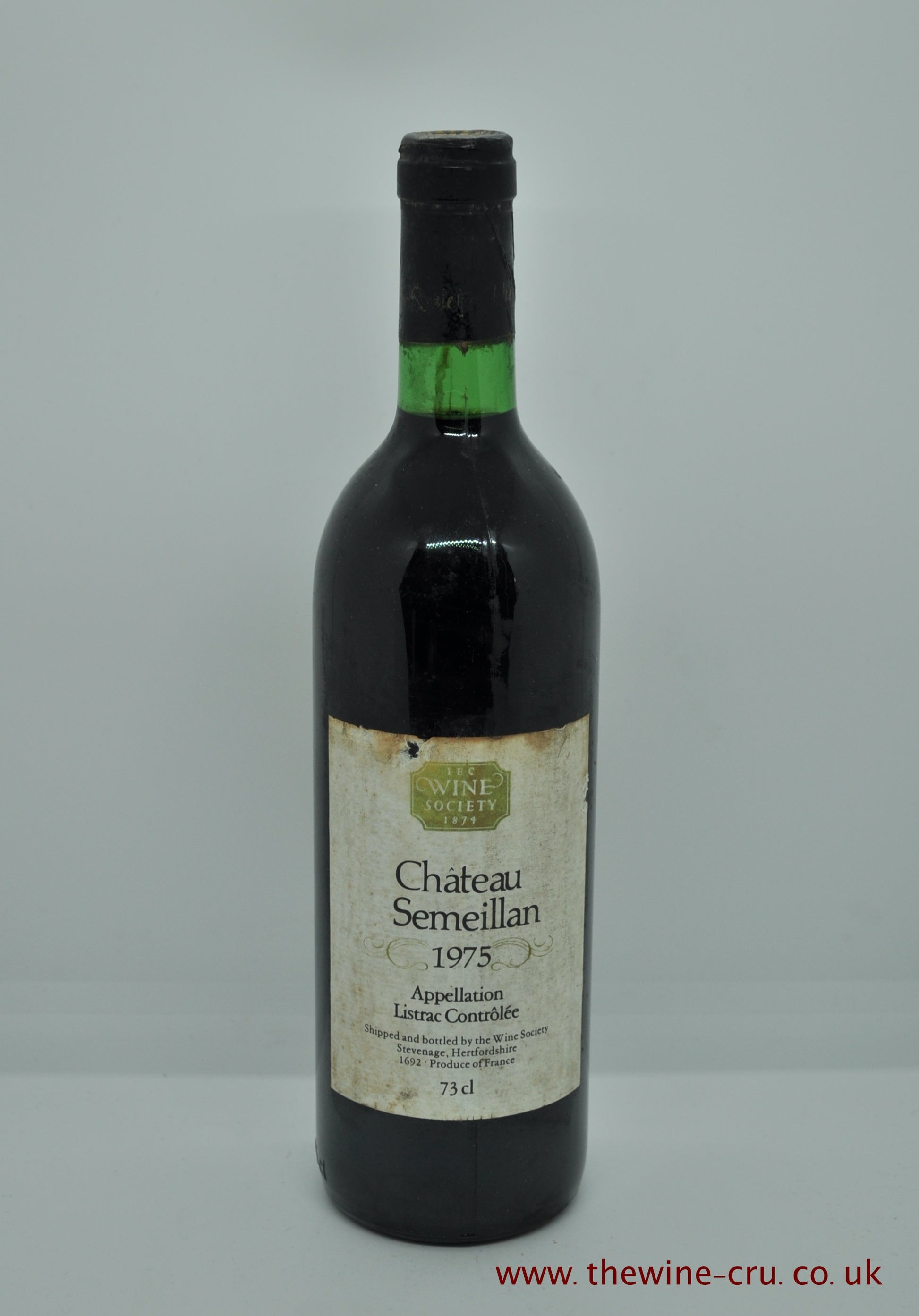 A bottle of 1975 vintage red wine from Chateau Semeillan in Listrac, Bordeaux, France. The bottle is in good condition with the wine level at the base of the neck. Immediate delivery. Free local delivery. Gift wrapping available.