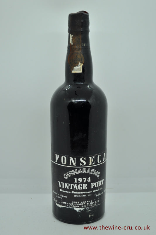 1974 vintage port wine. Fonseca Guimaens Vintage Port. The capsule is a little damaged, label bin soiled and the wine level is very top shoulder. Immediate delivery. Free local delivery. Gift wrapping available.