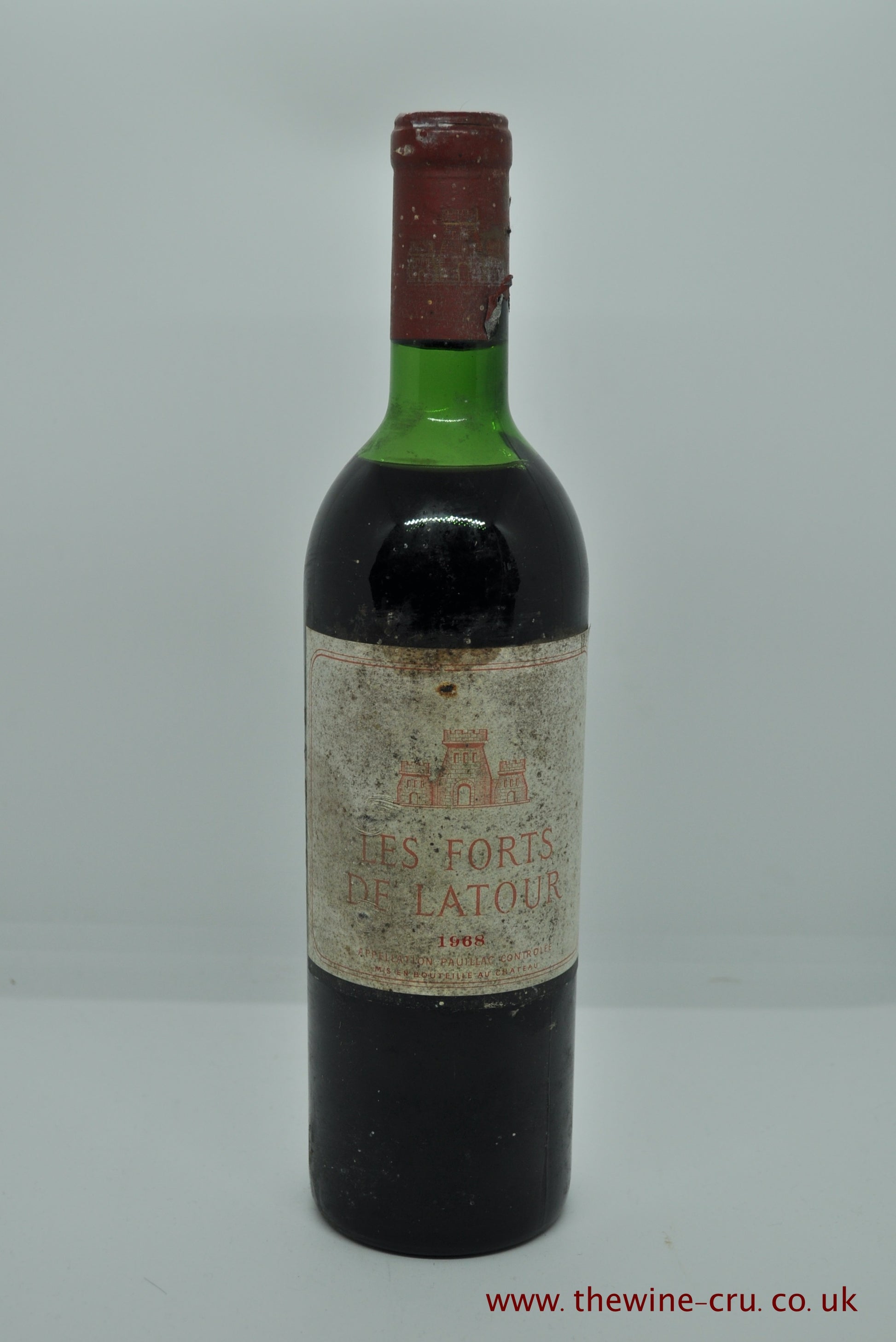 A bottle of 1968 vintage red wine. Les Forts de Latour the 2nd wine of Chateau Latour, France, Bordeaux. The label is bin soiled and the level top shoulder. Immediate delivery. Free local delivery. Gift wrapping available.