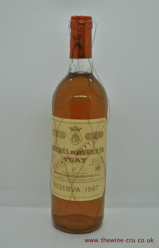1987 vintage white wine. Marques de Murrieta Ygay reserva blanco. Spain. The bottle is in good condition generally . Wire mesh is still attached with breaks in it and the level of the wine is base of neck. Immediate delivery. Free local delivery. Gift wrapping available.