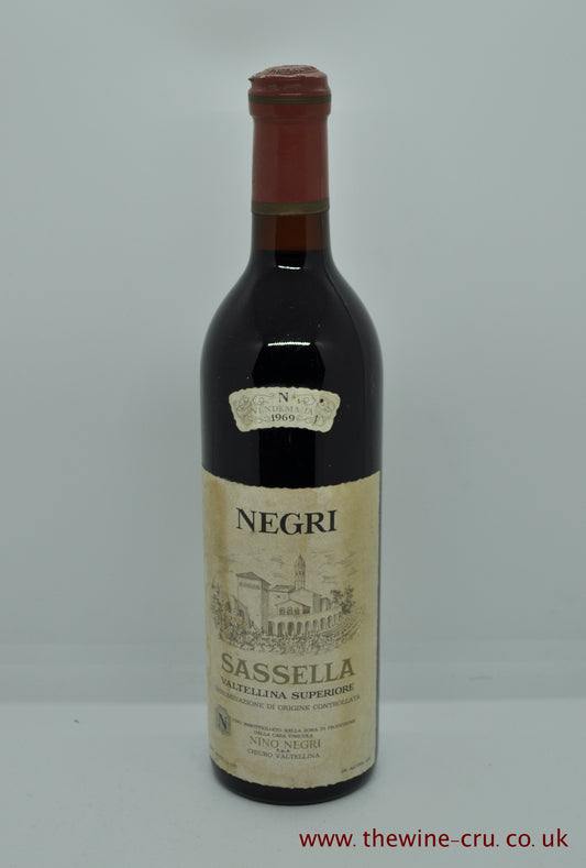 A bottle of 1969 vintage red wine. Nino Negri Sassella, Italy. The bottle is in good condition with the wine level being base of neck. Immediate delivery. Free local delivery. Gift wrapping available.