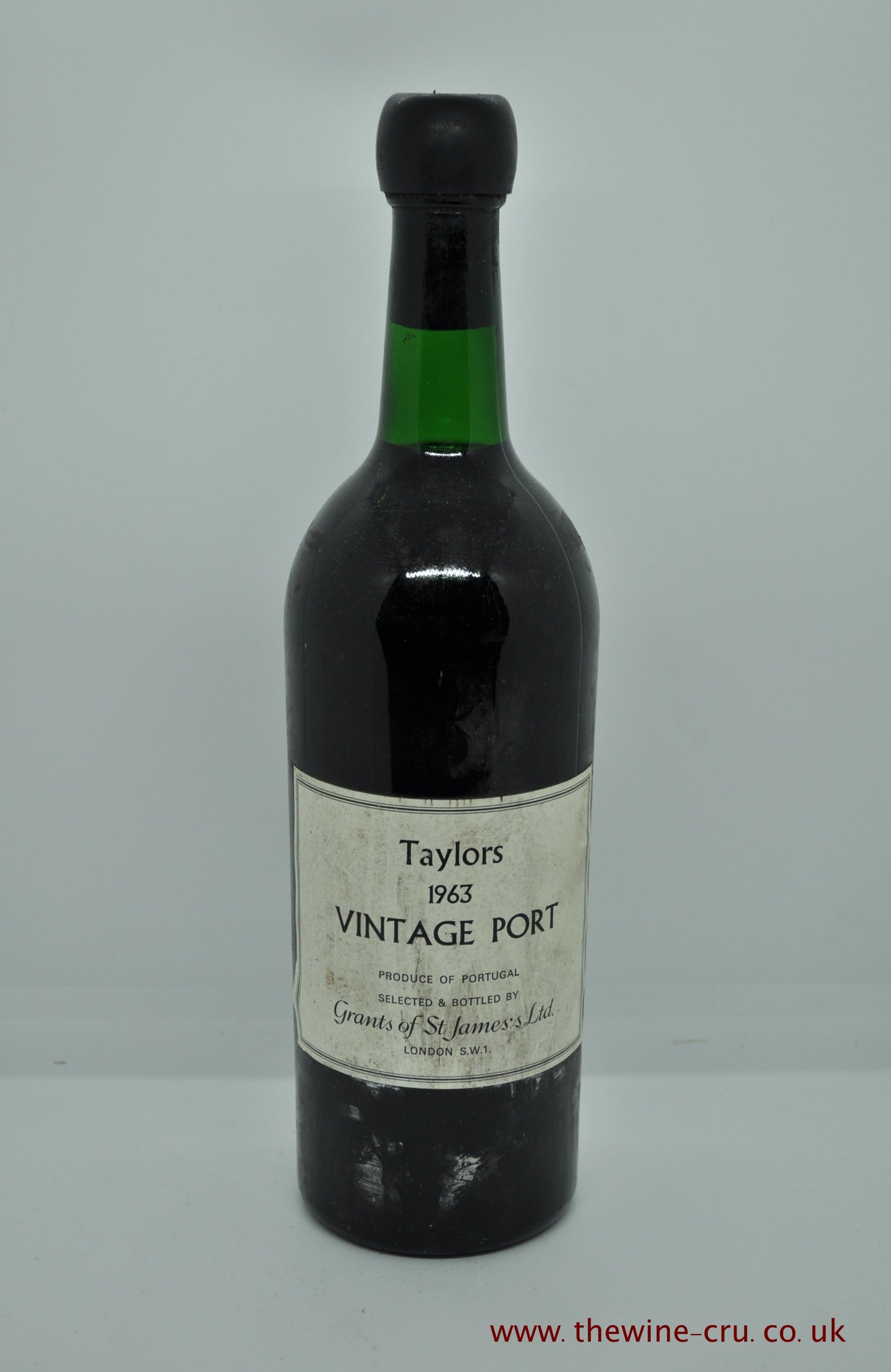 1963 vintage port wine. Taylors Vintage Port. Portugal. The bottle is in good condition with the wine level being base of neck. Immediate delivery. Free local delivery. Gift wrapping available.