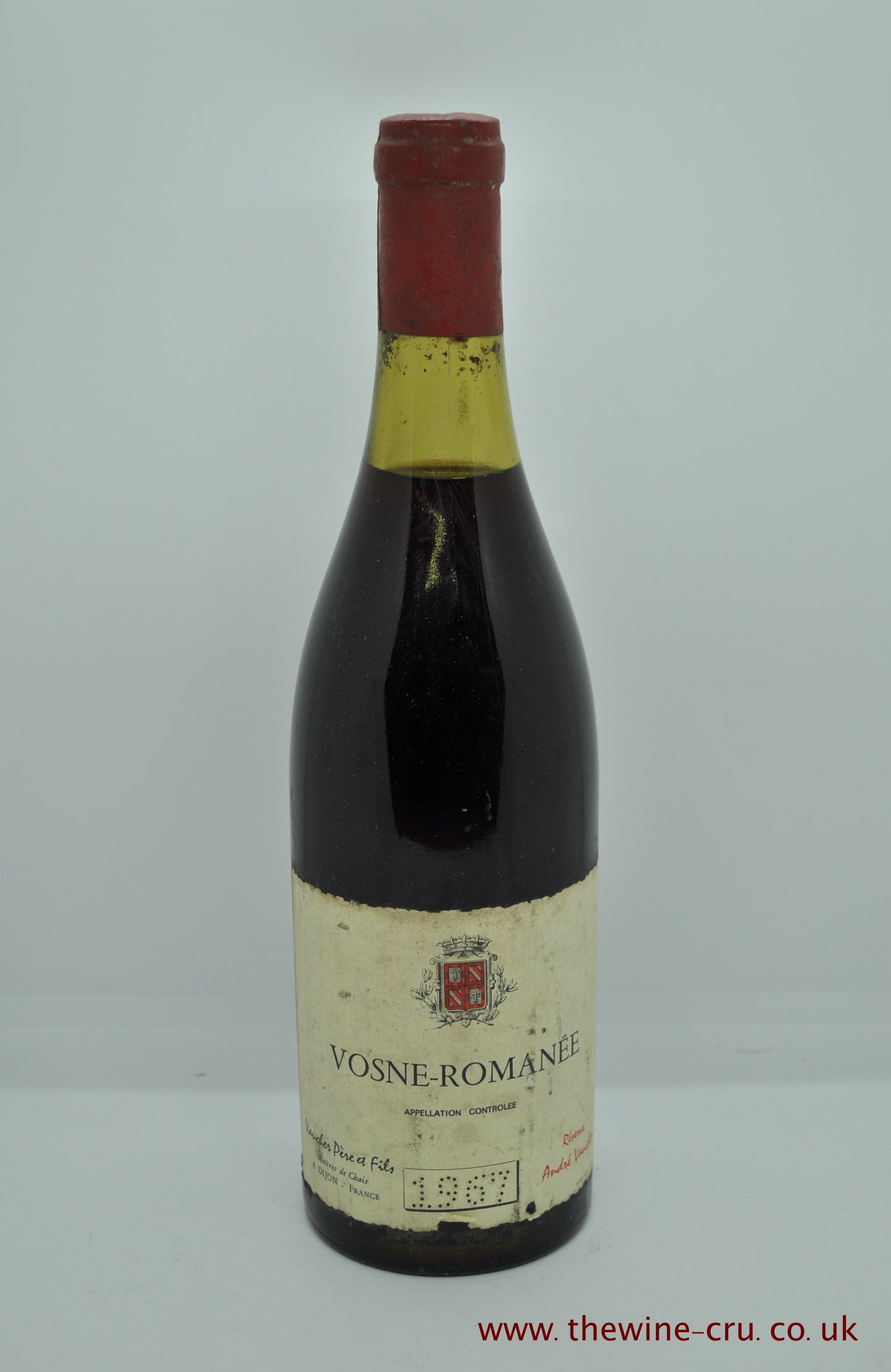 A bottle of 1967 vintage red wine. Vosne-Romanee Vaucher Pere & Fils. Burgundy France. The bottle is in good condition, label a little bin soiled and the level is 3cm below base of the cork. Gift wrapping available. Immediate delivery. Free local delivery.